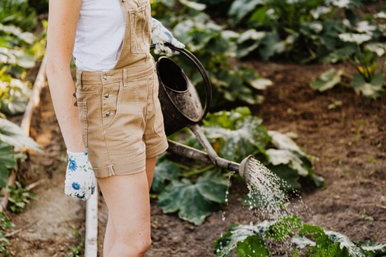 A girl watering her plants.